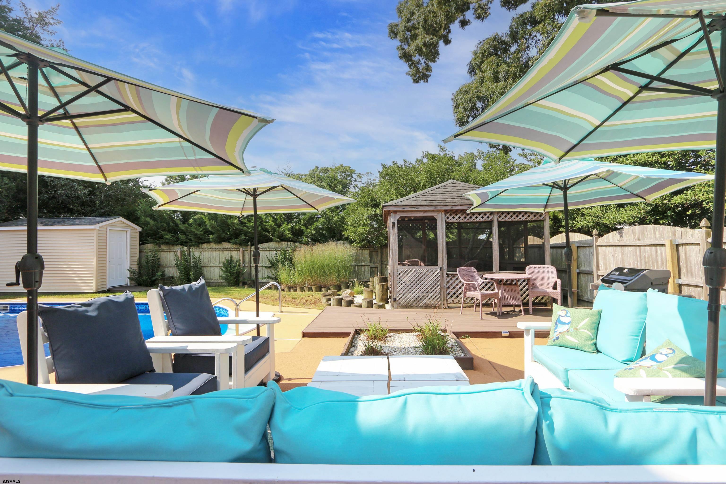226 Ridgewood Drive Northfield, NJ 08225 - Photo 32 of 41 a view of backyard of house with yard patio and outdoor seating