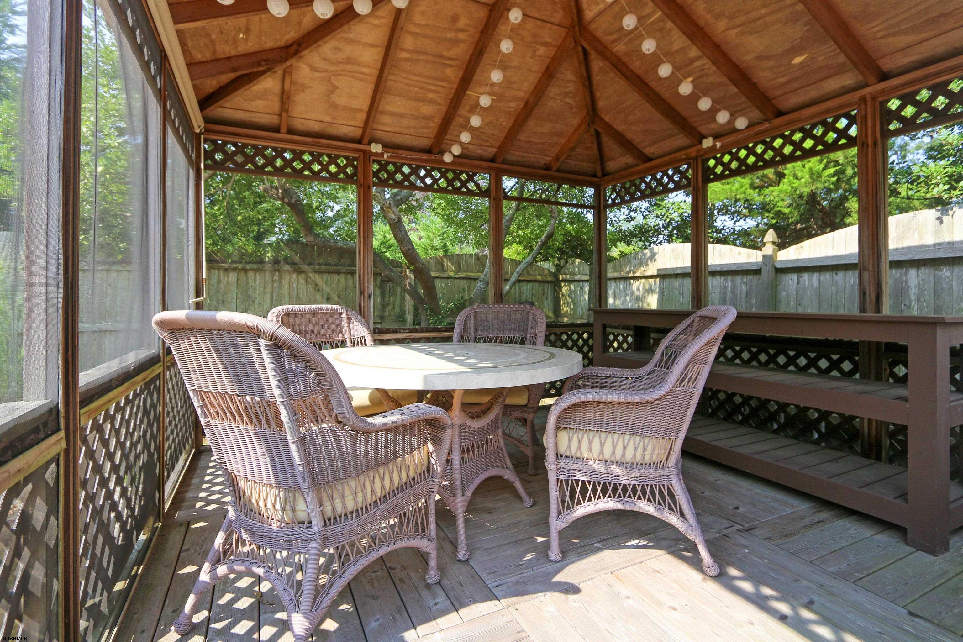 226 Ridgewood Drive Northfield, NJ 08225 - Photo 33 of 41 a table and chairs in the patio