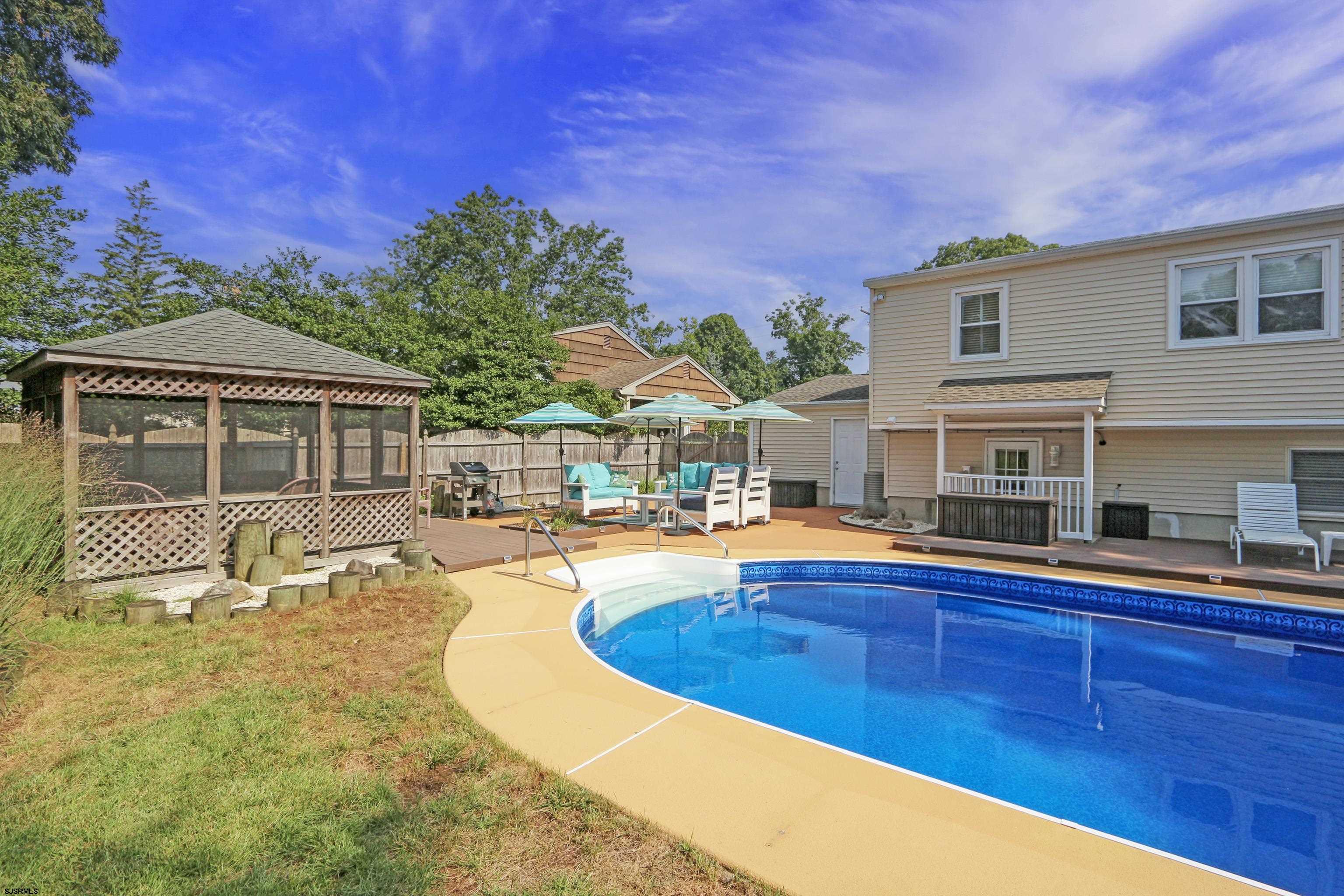 226 Ridgewood Drive Northfield, NJ 08225 - Photo 35 of 41 a view of a house with swimming pool and sitting area