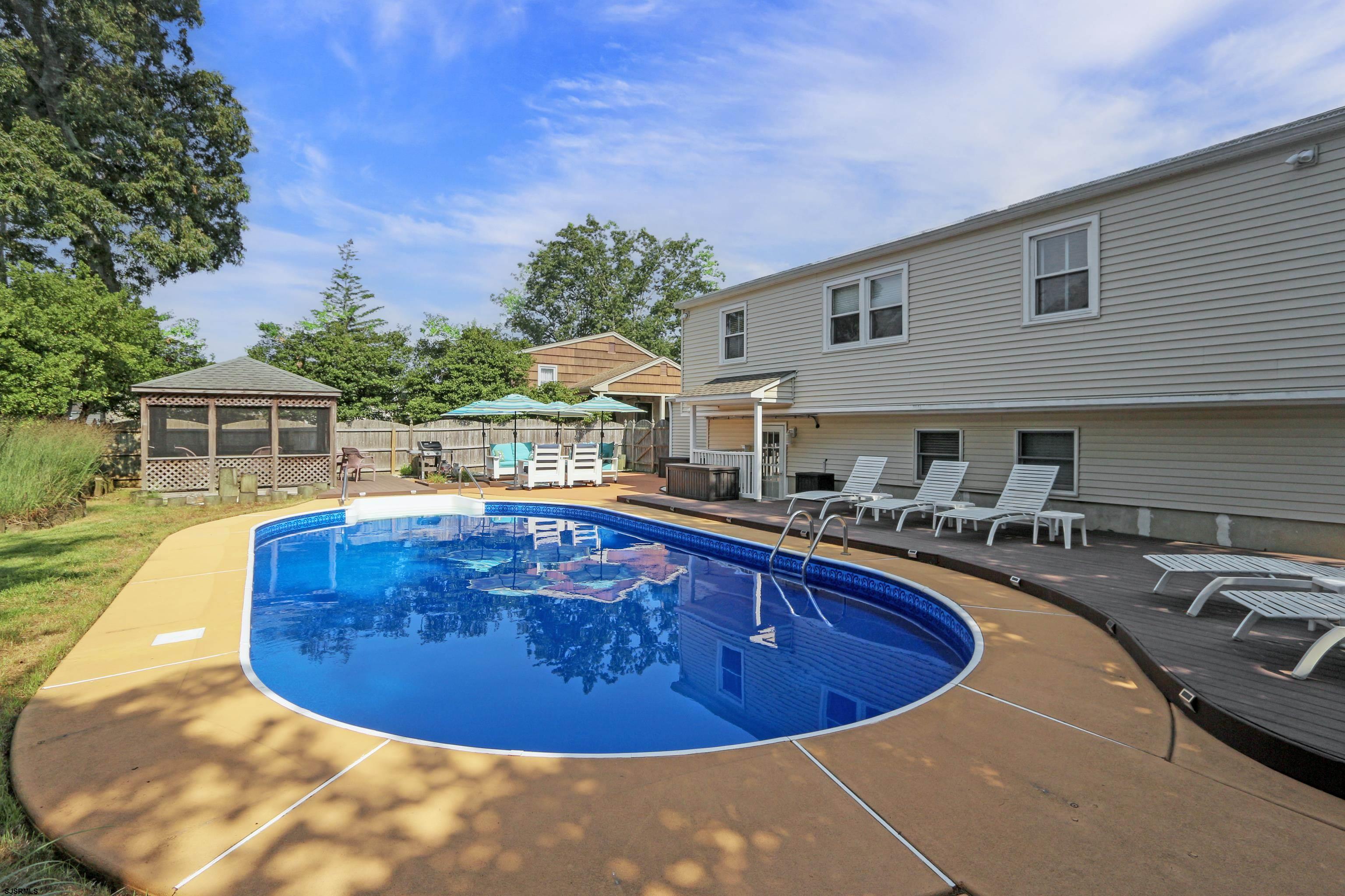 226 Ridgewood Drive Northfield, NJ 08225 - Photo 36 of 41 a view of a swimming pool with a patio