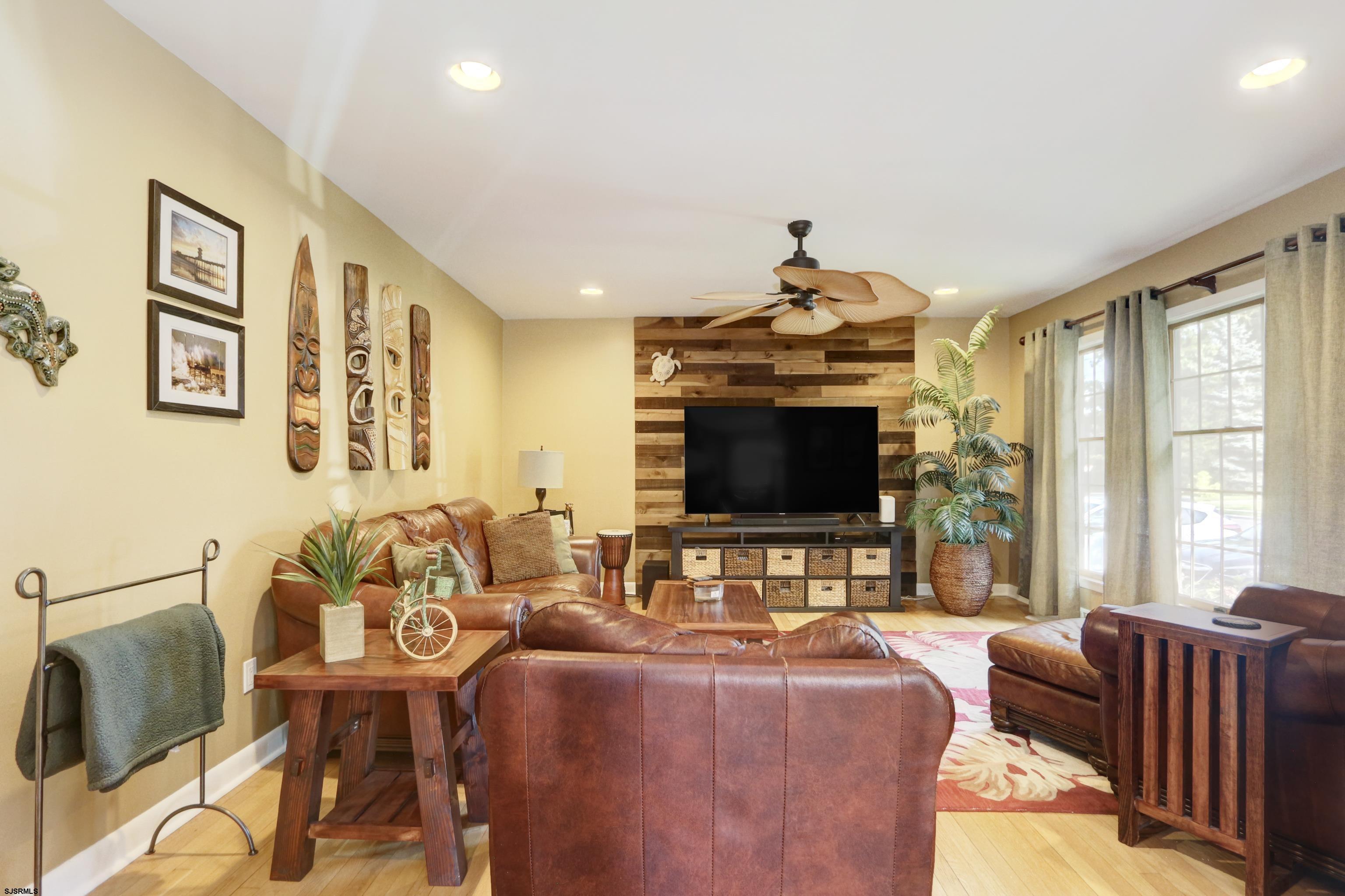 226 Ridgewood Drive Northfield, NJ 08225 - Photo 4 of 41 a living room with furniture and a flat screen tv