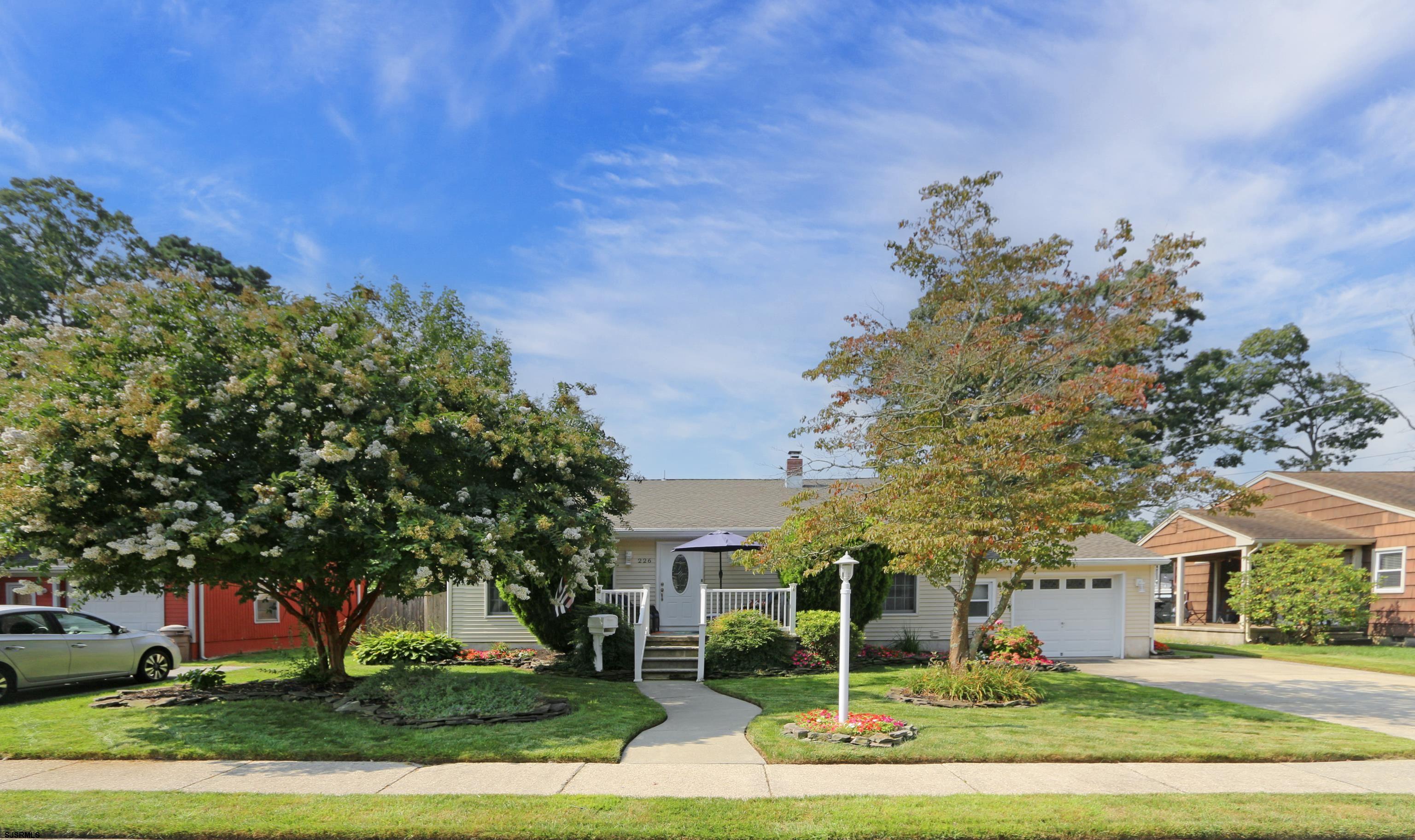 226 Ridgewood Drive Northfield, NJ 08225 - Photo 41 of 41 front view of a house with a yard