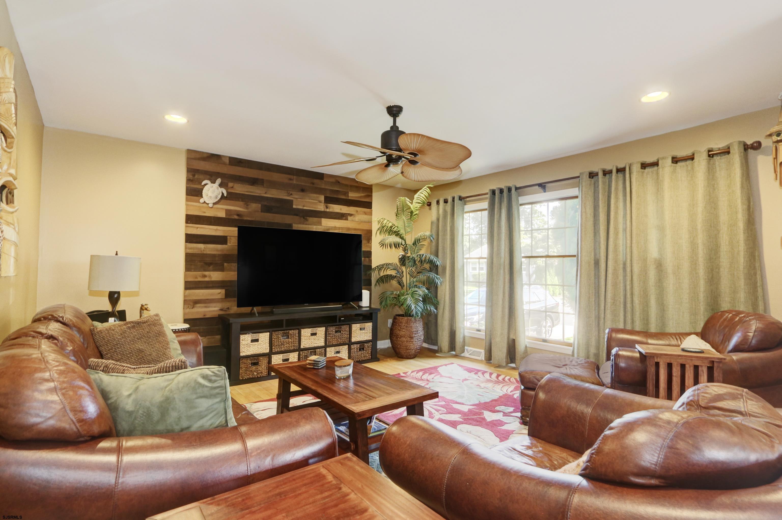 226 Ridgewood Drive Northfield, NJ 08225 - Photo 5 of 41 a living room with furniture and a flat screen tv