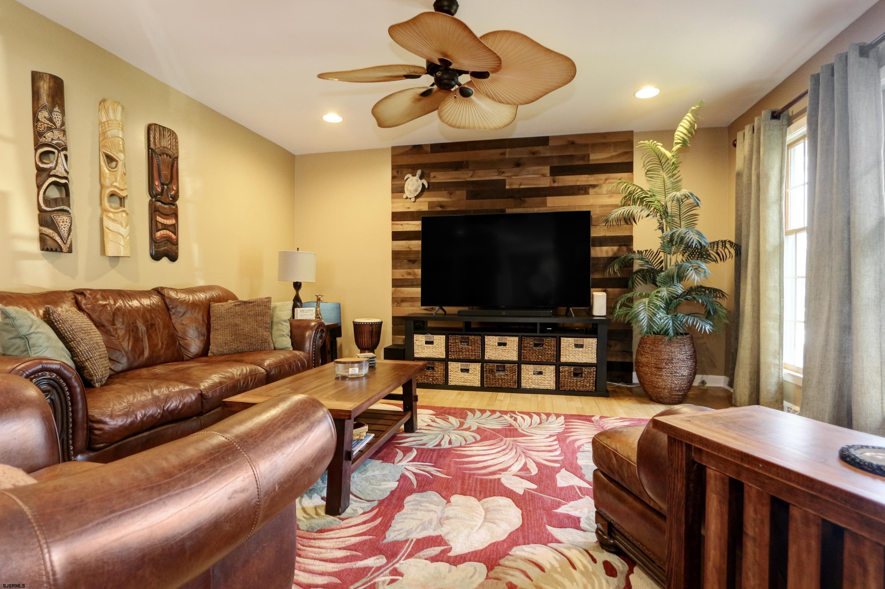 226 Ridgewood Drive Northfield, NJ 08225 - Photo 6 of 41 a living room with fireplace furniture and a flat screen tv