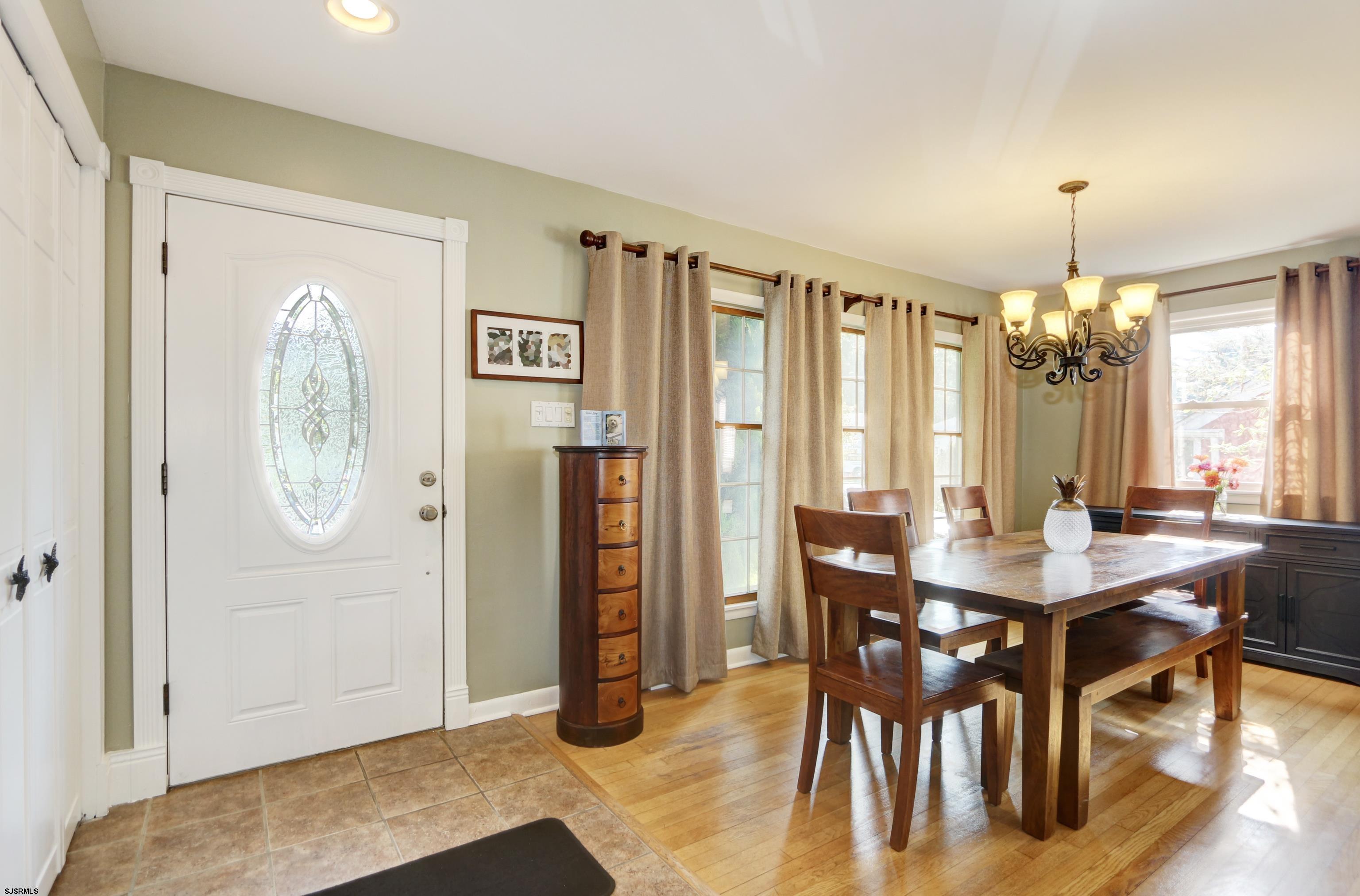 226 Ridgewood Drive Northfield, NJ 08225 - Photo 7 of 41 a view of a a dining room with furniture window and wooden floor