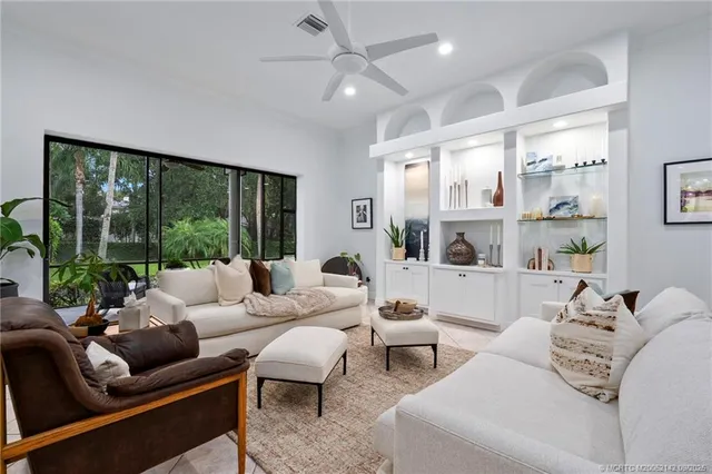 a view of a hallway with closet and bathroom