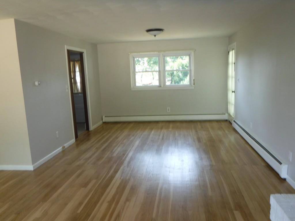 40 Bemis Road Holyoke, MA 01040 - Photo 13 of 29 an empty room with wooden floor and windows