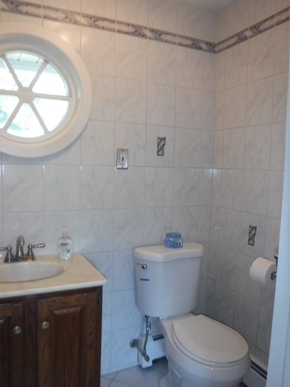 40 Bemis Road Holyoke, MA 01040 - Photo 16 of 29 a bathroom with a sink a toilet and a mirror