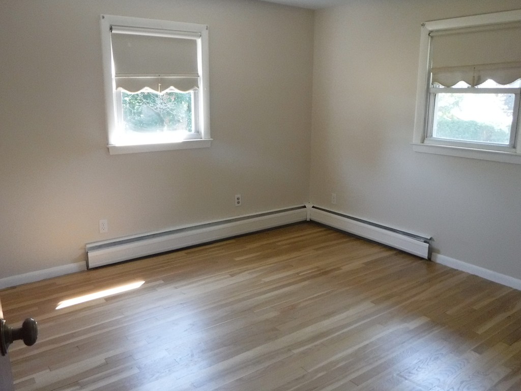 40 Bemis Road Holyoke, MA 01040 - Photo 17 of 29 an empty room with wooden floor and windows