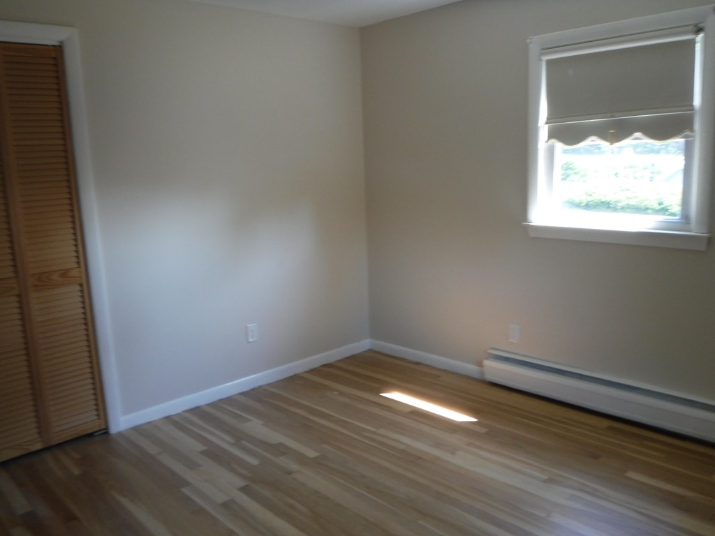40 Bemis Road Holyoke, MA 01040 - Photo 18 of 29 an empty room with wooden floor and windows