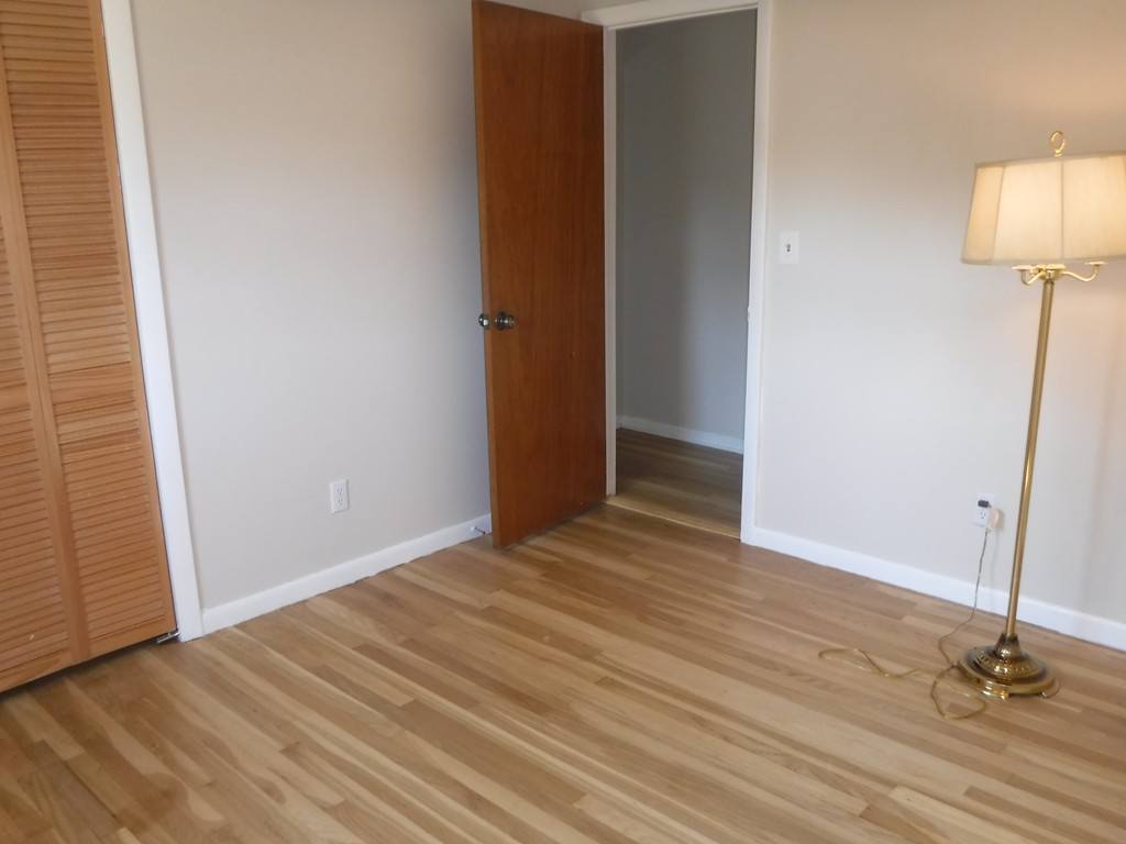 40 Bemis Road Holyoke, MA 01040 - Photo 19 of 29 an empty room with wooden floor and a ceiling fan