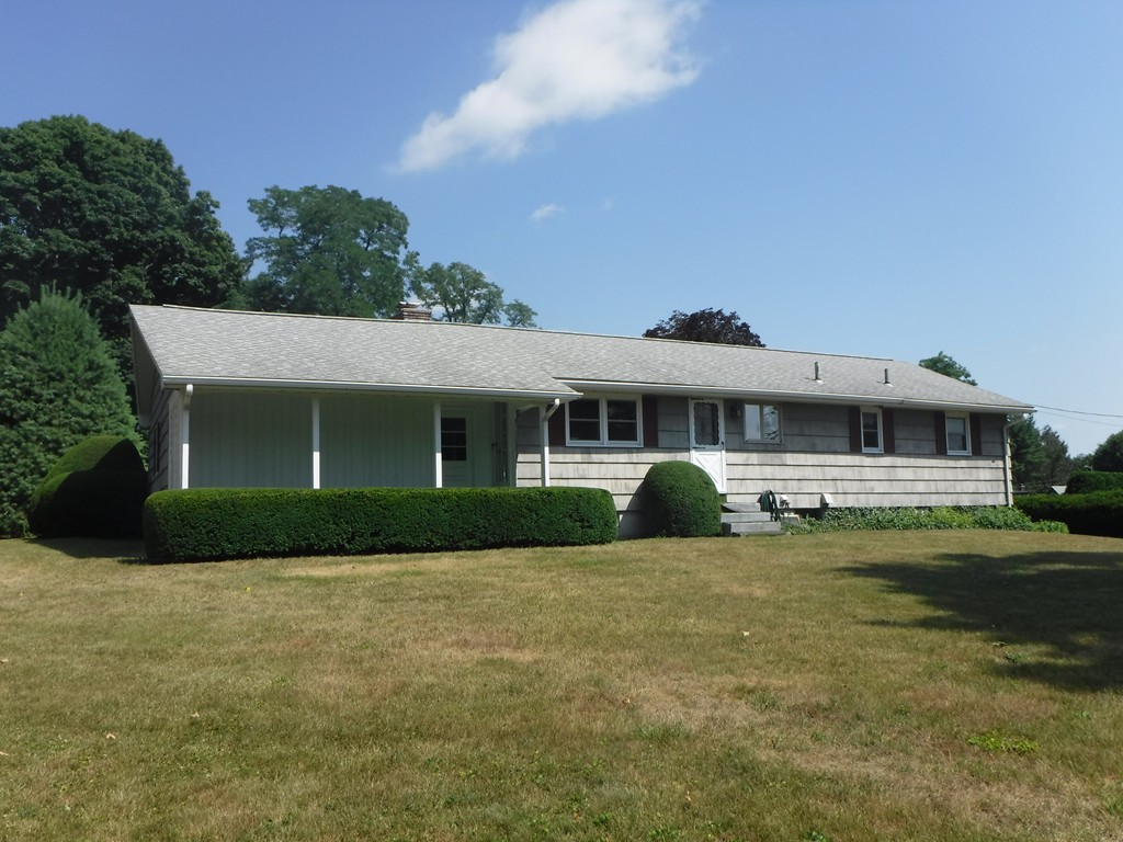 40 Bemis Road Holyoke, MA 01040 - Photo 26 of 29 a front view of a house with a garden and yard