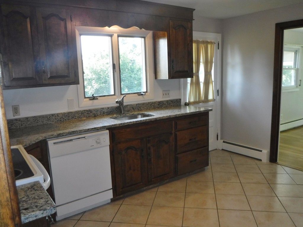 40 Bemis Road Holyoke, MA 01040 - Photo 5 of 29 a kitchen with a sink a window and cabinets