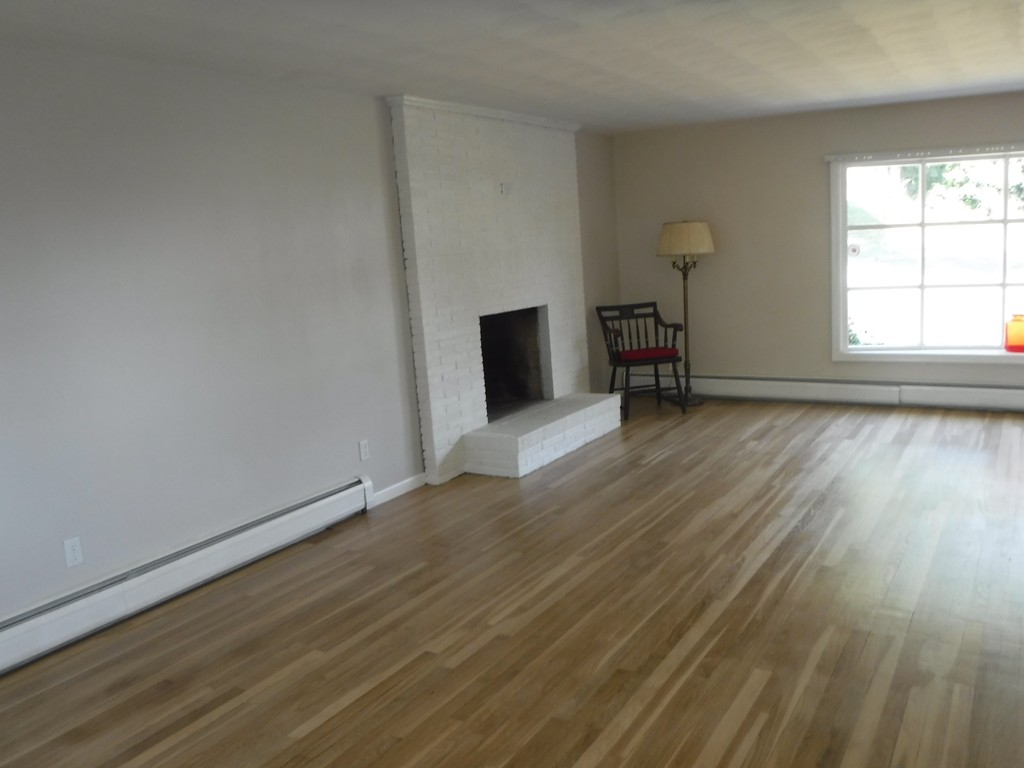 40 Bemis Road Holyoke, MA 01040 - Photo 8 of 29 an empty room with wooden floor and windows