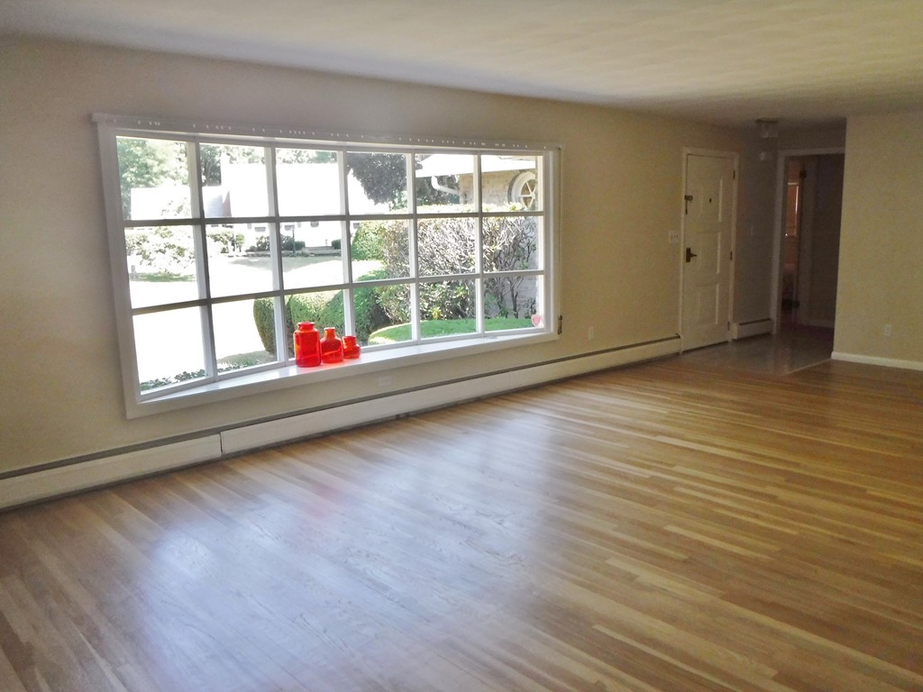 40 Bemis Road Holyoke, MA 01040 - Photo 10 of 29 an empty room with wooden floor and windows