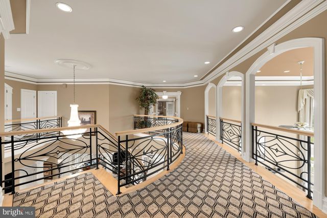 a room with pool table and windows