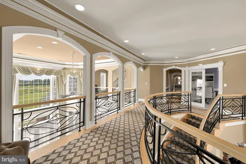 a bedroom with a bed and a mirror on the dresser