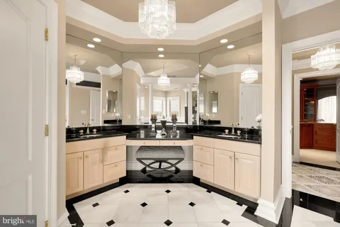 a living room with furniture a fireplace and a dining table with wooden floor