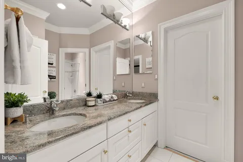 an outdoor sitting area with furniture and umbrella