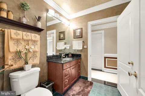 a aerial view of a house with yard and green space