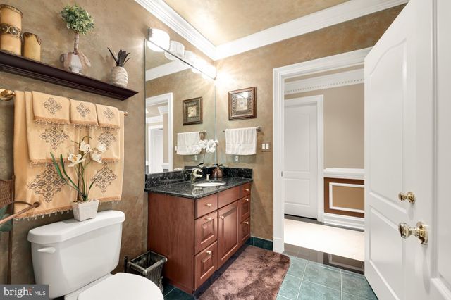 a aerial view of a house with yard and green space