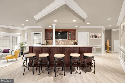 an aerial view of a house with swimming pool garden view and lake view