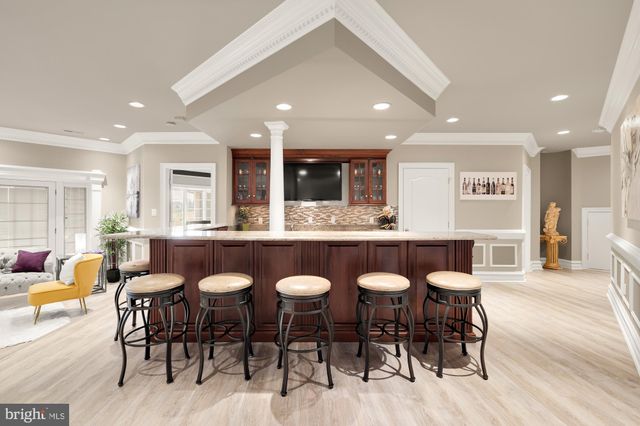 an aerial view of a house with swimming pool garden view and lake view