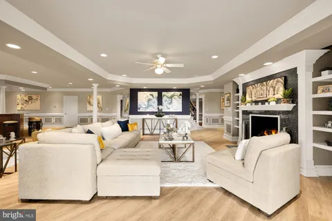 an aerial view of a house with a swimming pool outdoor seating and yard