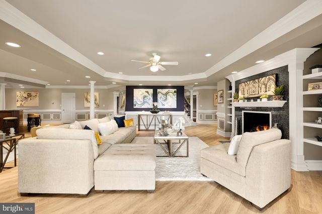 an aerial view of a house with a swimming pool outdoor seating and yard