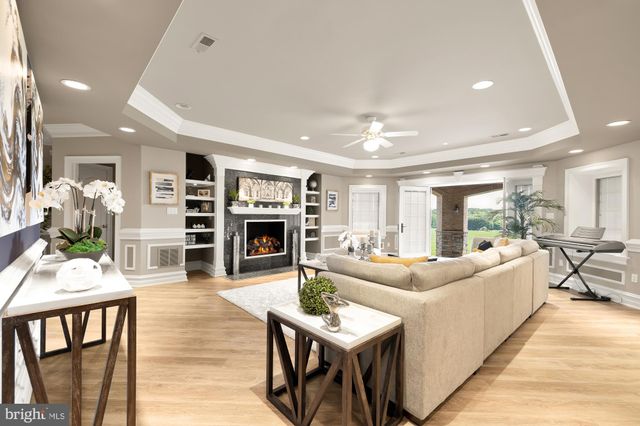 an aerial view of a house with a big yard