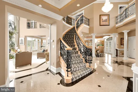 a living room with furniture a fireplace and a table