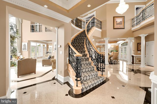 a living room with furniture a fireplace and a table