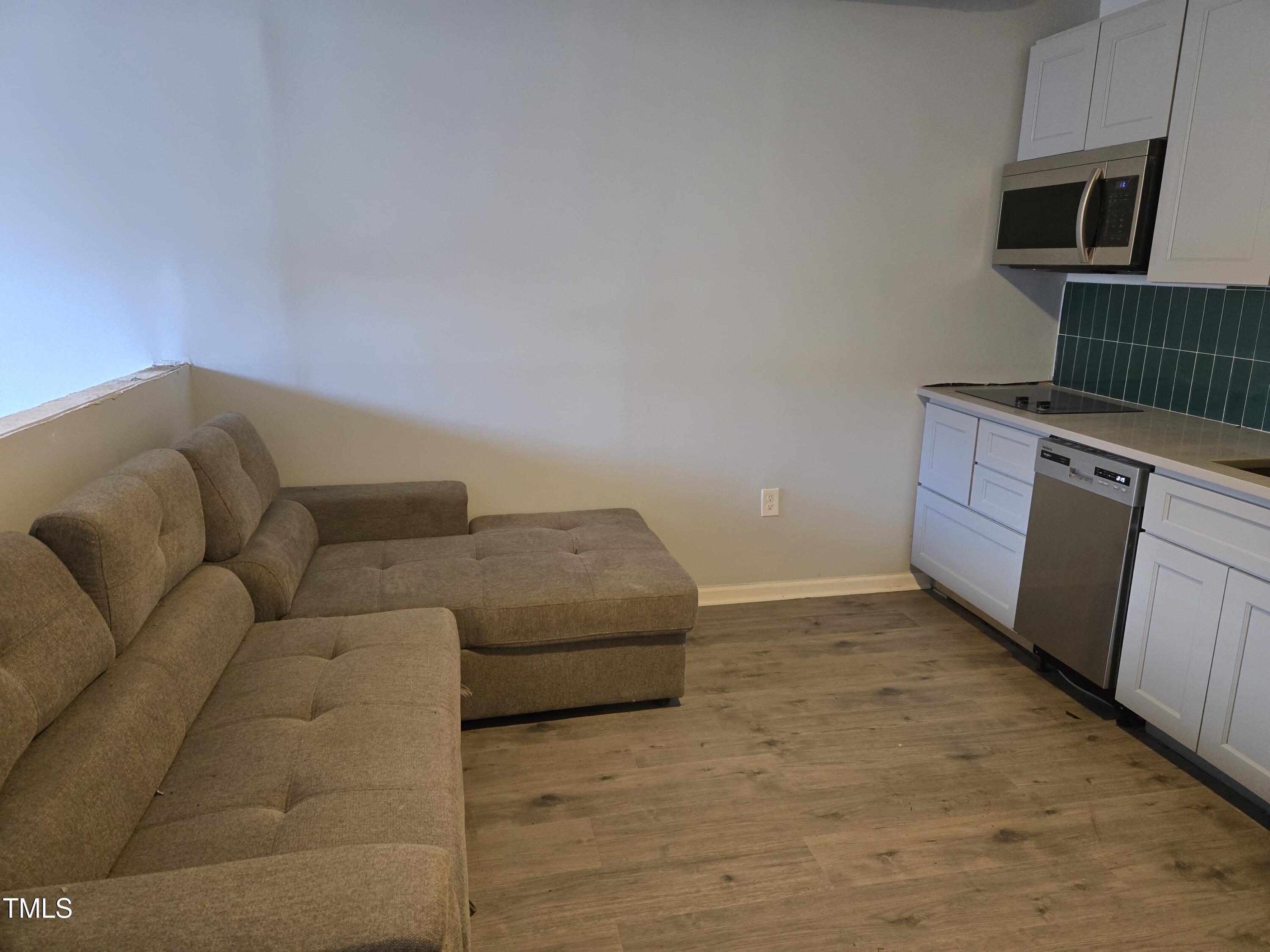 116 East Main Street Durham, NC 27701 - Photo 13 of 15 a living room with furniture and a fireplace