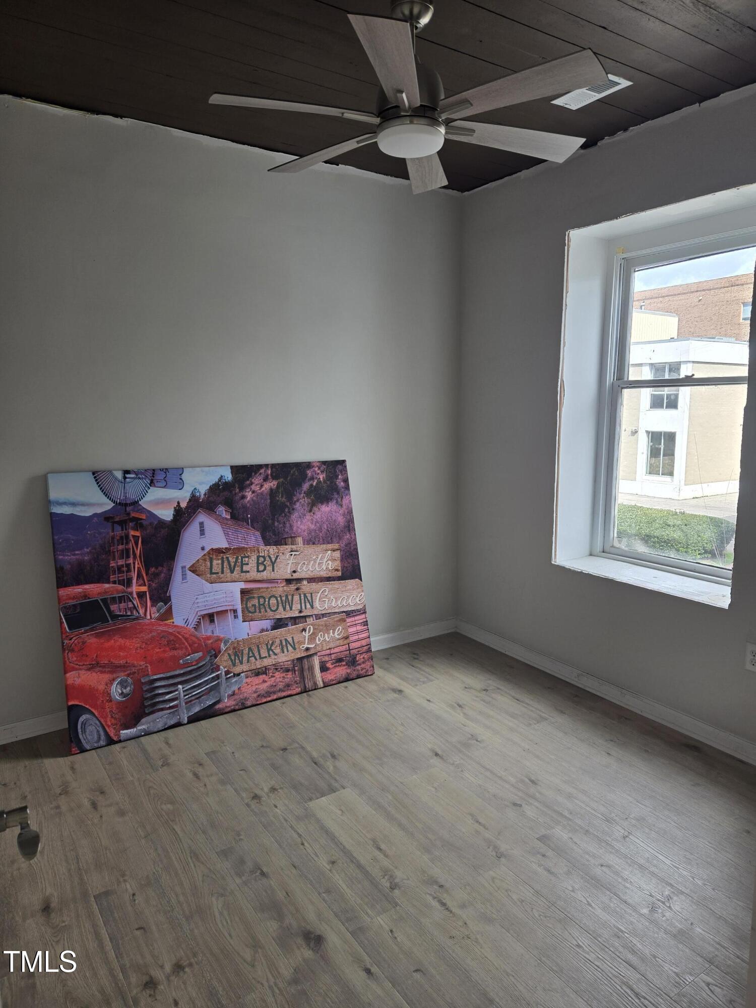 116 East Main Street Durham, NC 27701 - Photo 8 of 15 a bedroom with bed and window