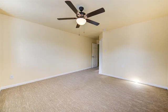 a front view of house with backyard and green space
