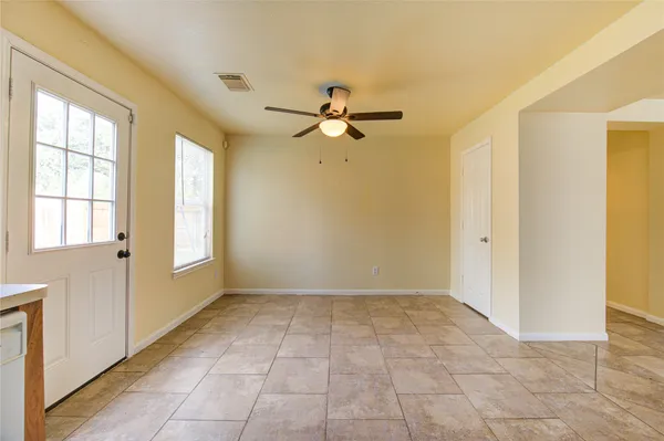 a view of an empty room with a window