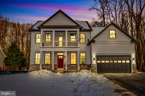 a front view of a house with yard