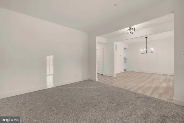 a kitchen with stainless steel appliances granite countertop a sink a stove and a wooden floors