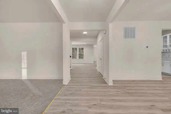 a view of empty room with ceiling fan