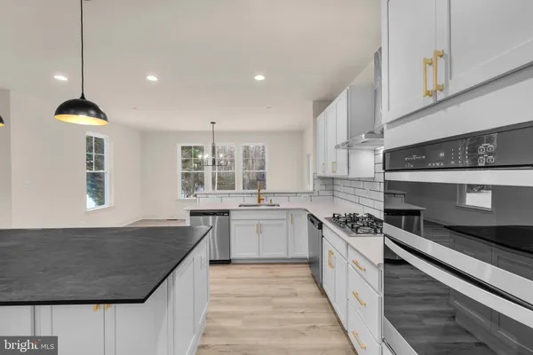 a view of an empty room with a fan