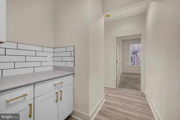 a bathroom with a bathtub sink and mirror
