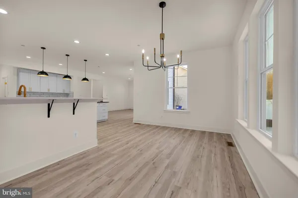 a bathroom with a toilet a sink and bathtub