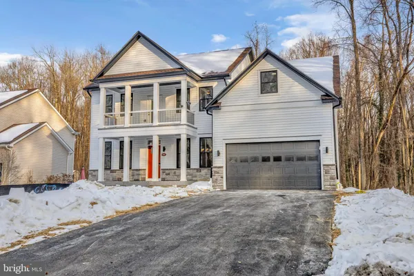 a front view of a house with yard