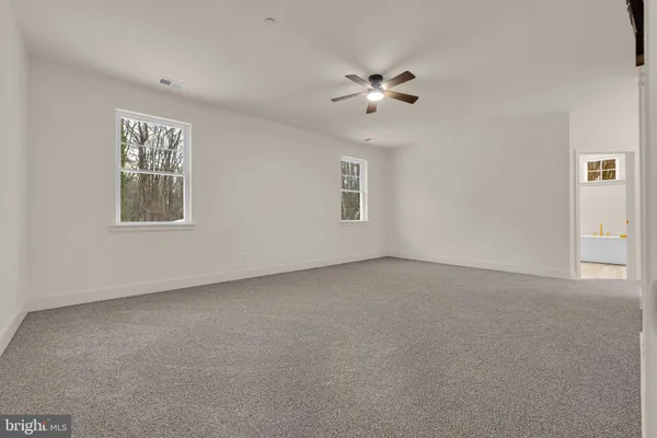 a room with furniture pool table and a lamp