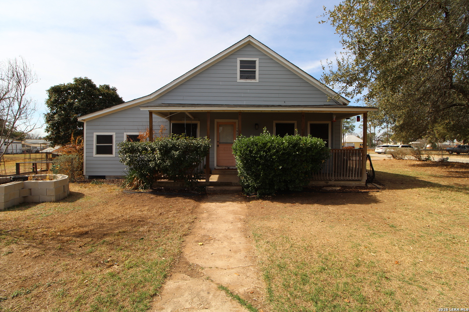 19231 Benton Lytle, TX 78052 - Photo 1 of 34 a front view of a house with yard and parking