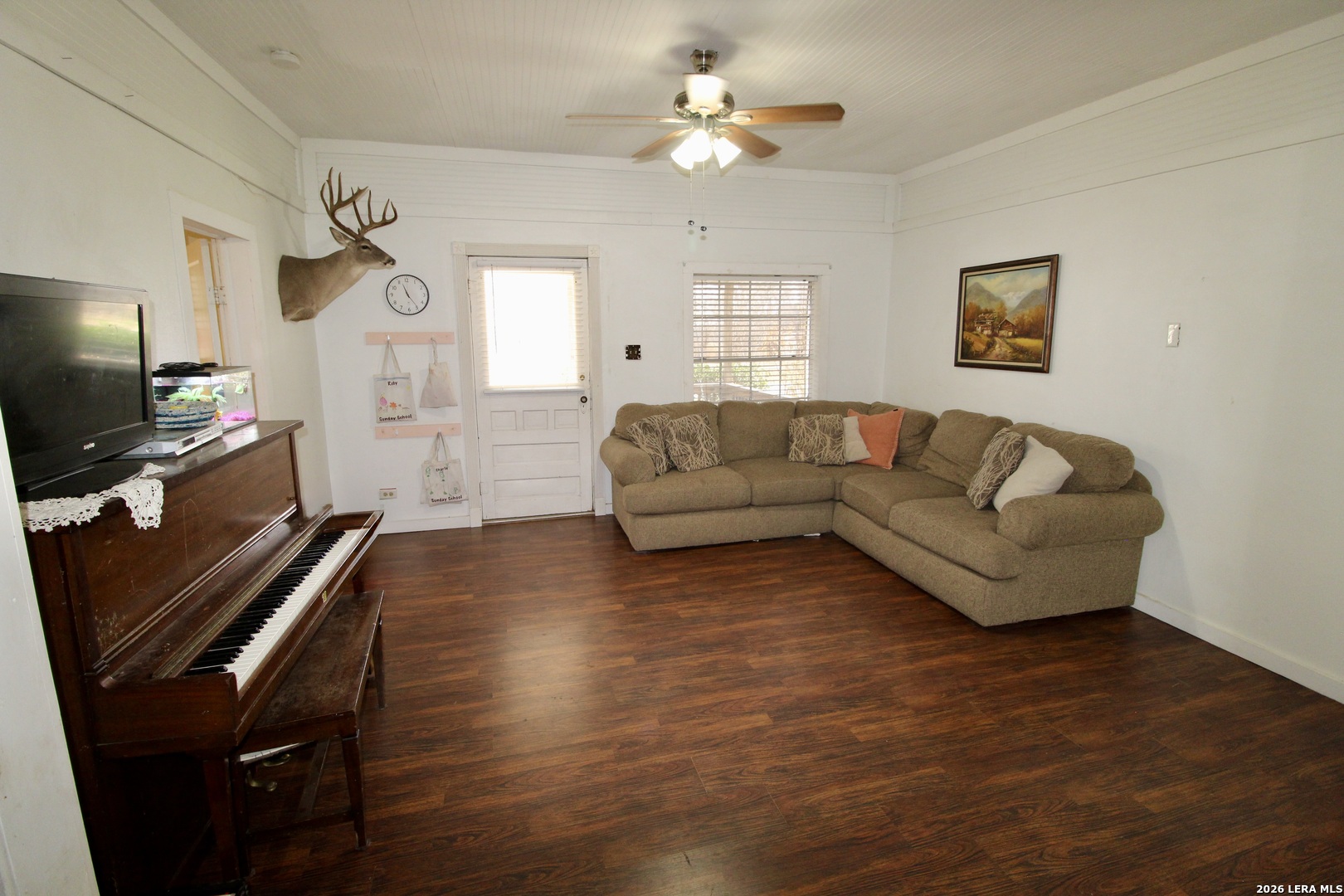 19231 Benton Lytle, TX 78052 - Photo 12 of 34 a living room with furniture a flat screen tv and a window