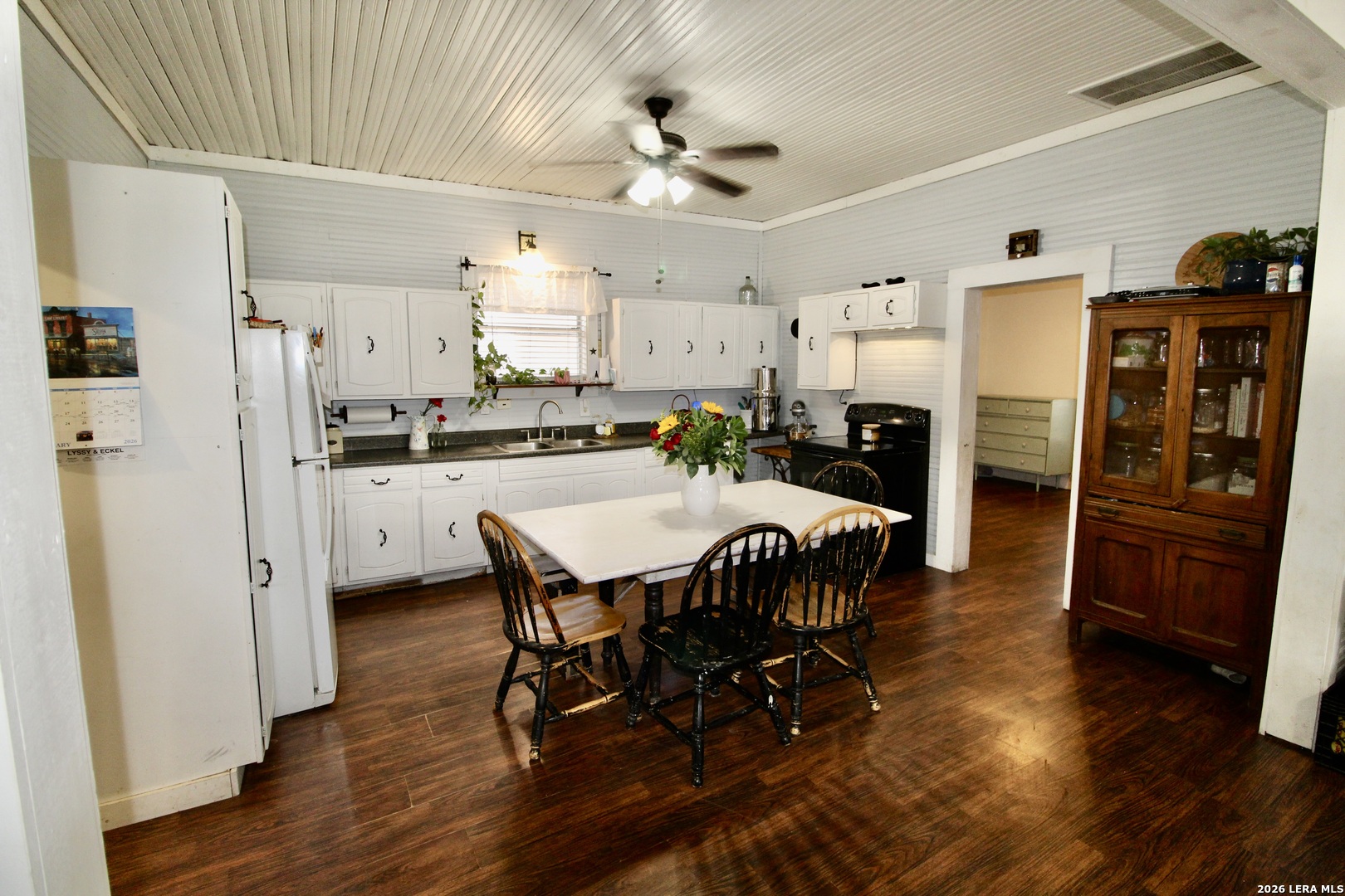 19231 Benton Lytle, TX 78052 - Photo 14 of 34 a view of a dining room with furniture and wooden floor