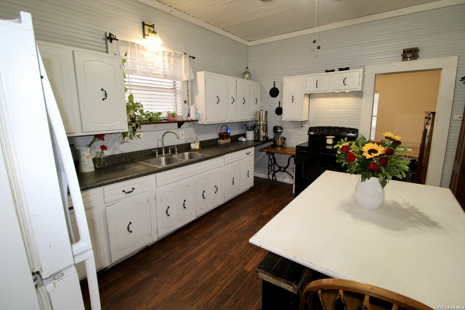 19231 Benton Lytle, TX 78052 - Photo 16 of 34 a kitchen with sink and refrigerator