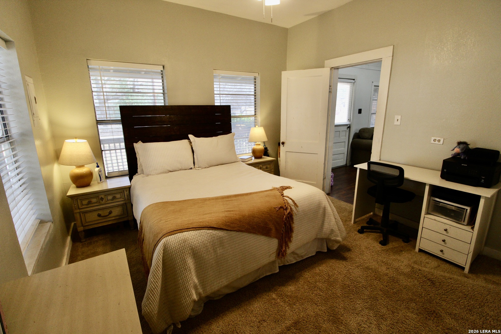 19231 Benton Lytle, TX 78052 - Photo 18 of 34 a bedroom with bed and wooden floor