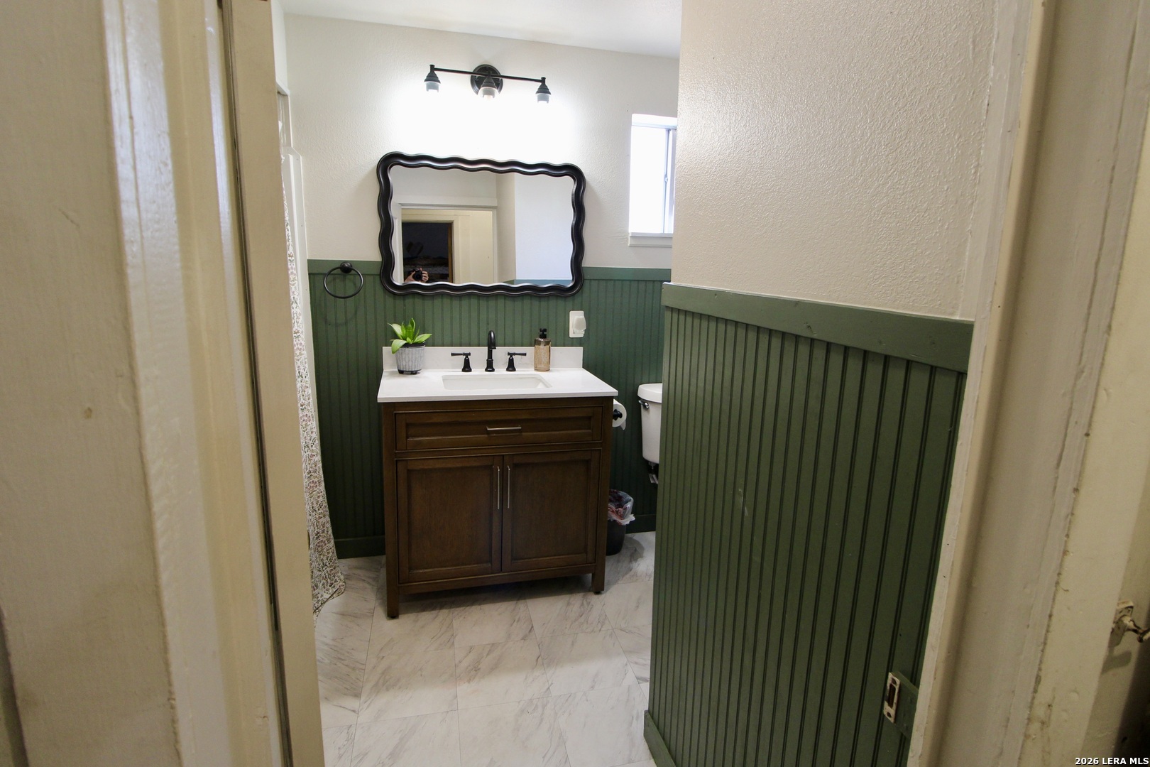 19231 Benton Lytle, TX 78052 - Photo 24 of 34 a bathroom with a sink and a mirror